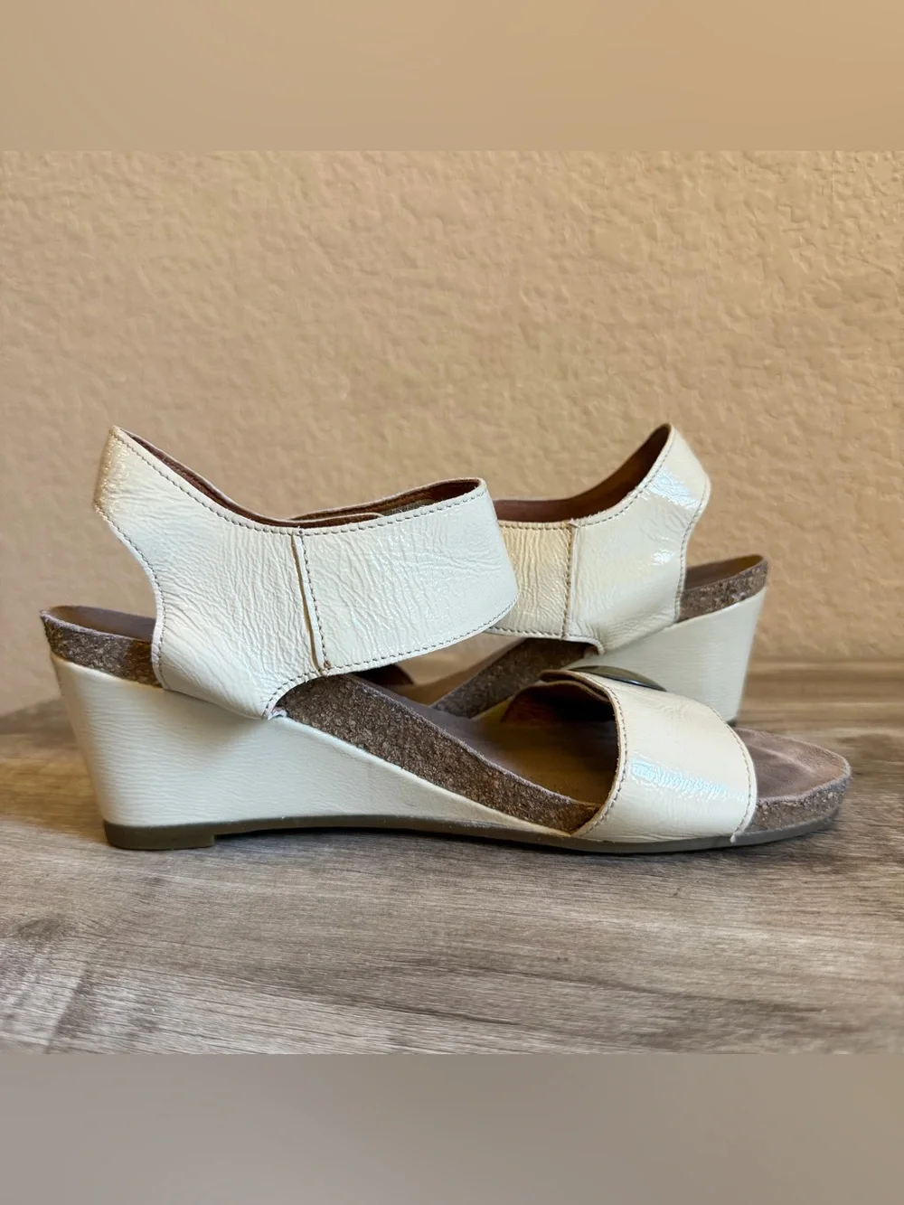 Taos Carousel wedge sandals cork-cushioned footbed metallic buttons